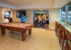 Members playing pool in the club house of Palm Harbor Marina